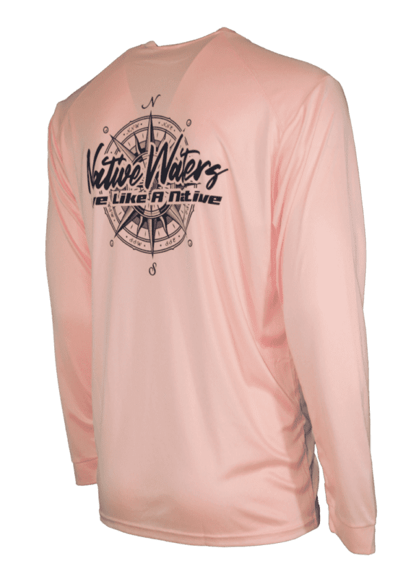 A pink long - sleeve shirt with a compass on it.