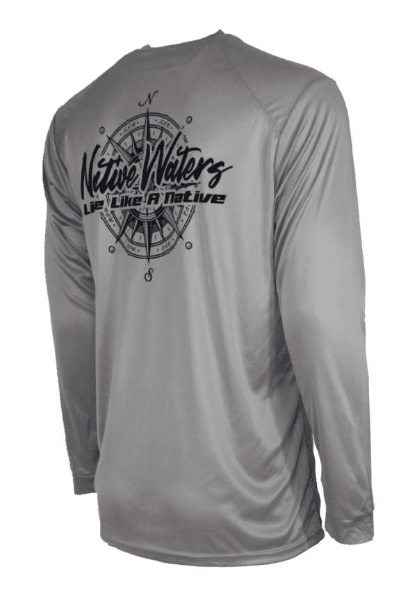 A gray long - sleeve shirt with a compass on it.