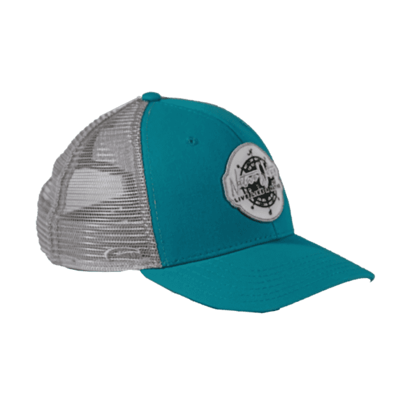 A teal trucker hat with a white patch on it.